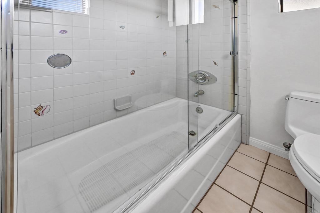223 3rd Street Encinitas, CA 92024 - Photo 14 of 68 a bathroom with a bathtub and a shower