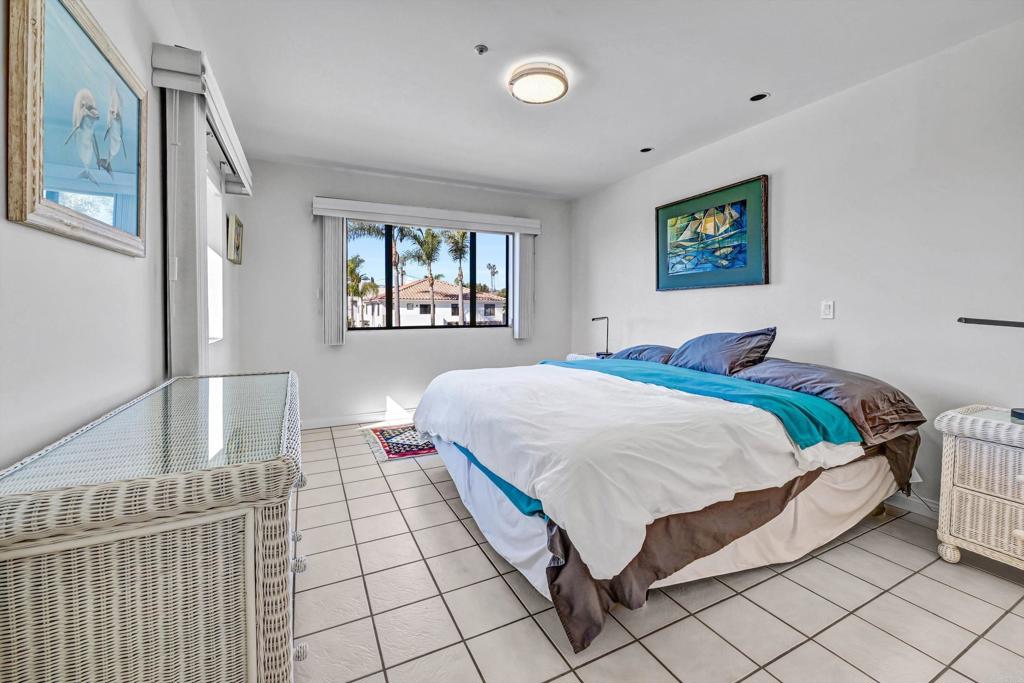 223 3rd Street Encinitas, CA 92024 - Photo 21 of 68 a bedroom with a bed and a window