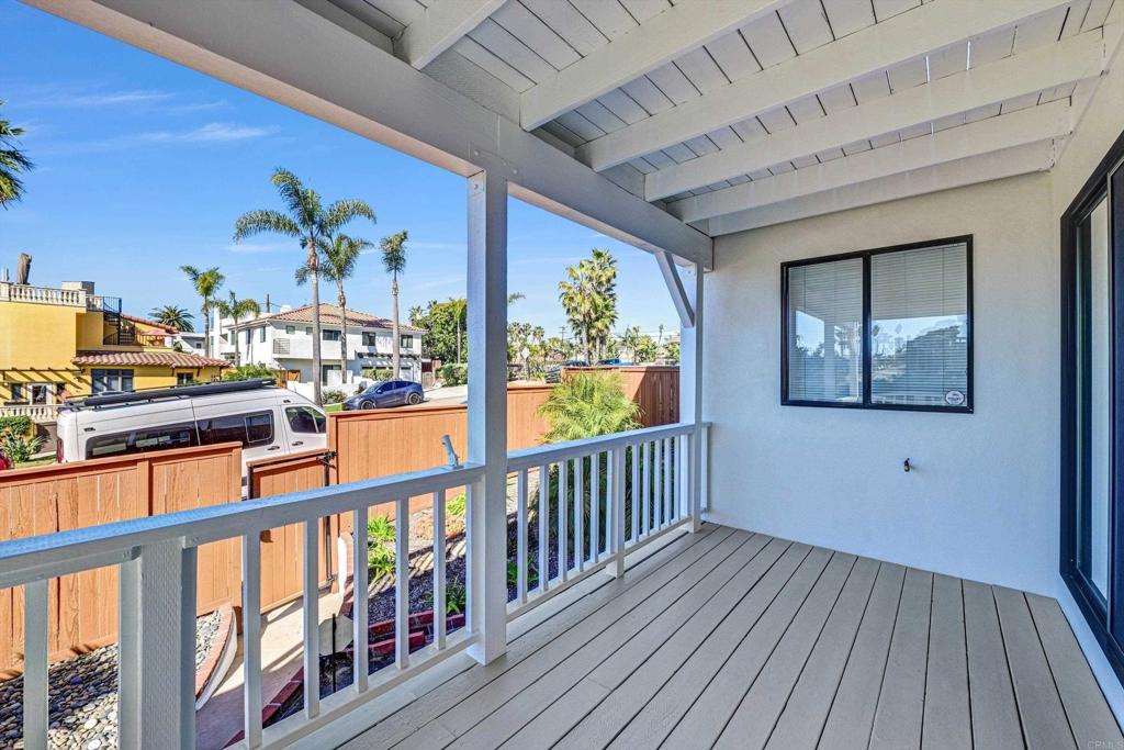 223 3rd Street Encinitas, CA 92024 - Photo 38 of 68 a view of a balcony with furniture and wooden floor