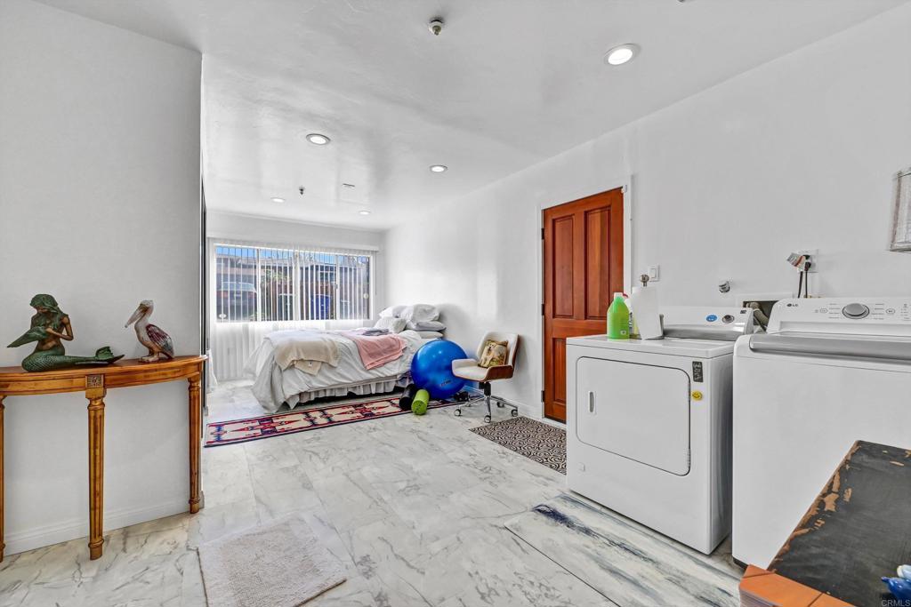 223 3rd Street Encinitas, CA 92024 - Photo 41 of 68 a bedroom with furniture and a window