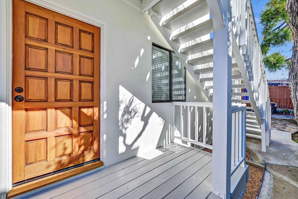 223 3rd Street Encinitas, CA 92024 - Photo 63 of 68 a view of an entryway with wooden floor and door