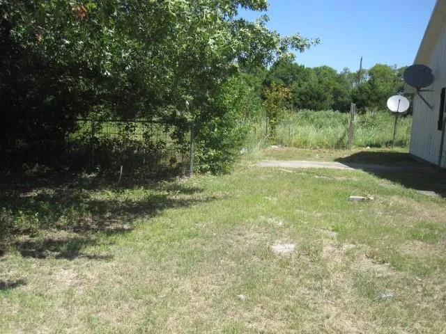a house with trees in front of it