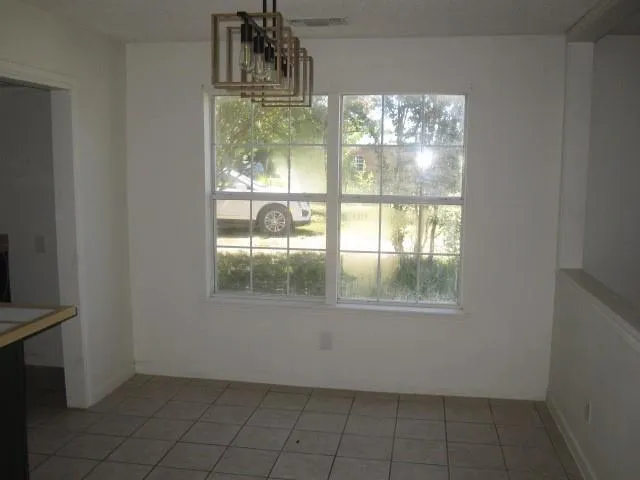 a view of an empty room and window
