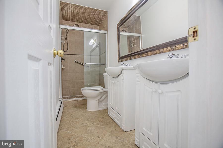 433 Walnut Lane Princeton, NJ 08540 - Photo 12 of 26 a bathroom with a sink a toilet and shower