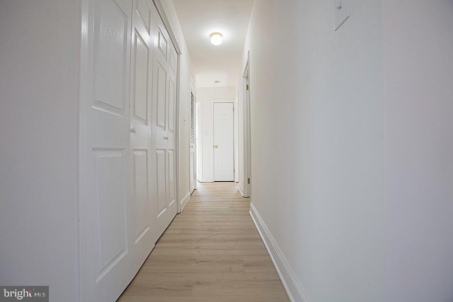 433 Walnut Lane Princeton, NJ 08540 - Photo 13 of 26 a view of a hallway with wooden floor