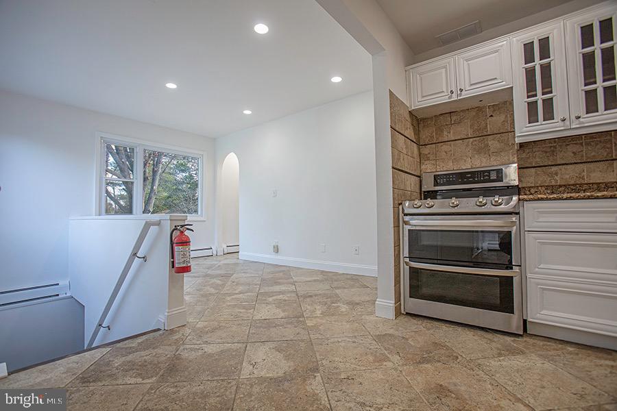 433 Walnut Lane Princeton, NJ 08540 - Photo 9 of 26 a view of kitchen and hallway with a stove