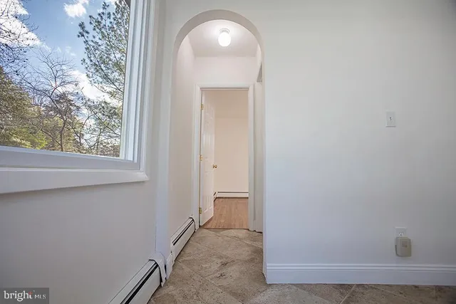 a view of a room that has a window in it