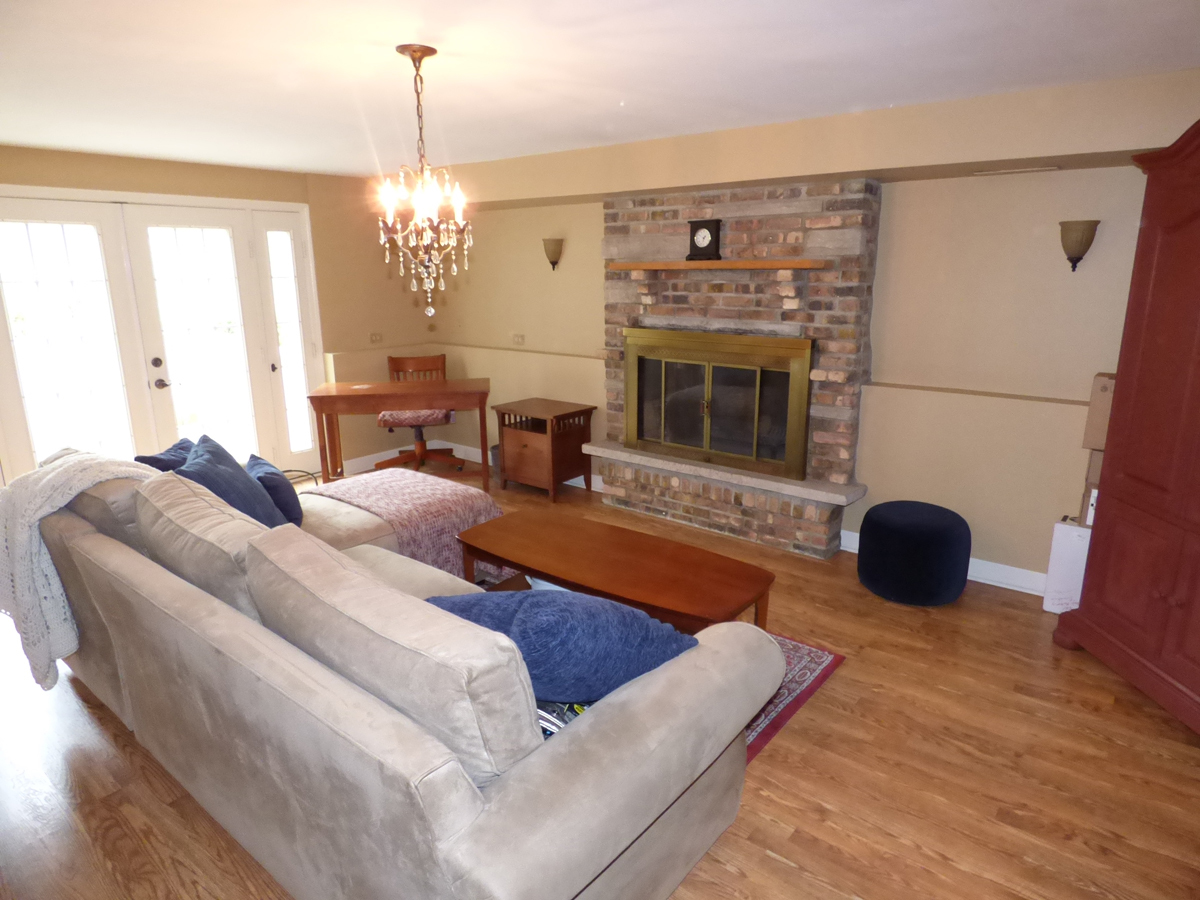 41W121 Whitney Road St. Charles, IL 60175 - Photo 21 of 35 a living room with furniture and a fireplace