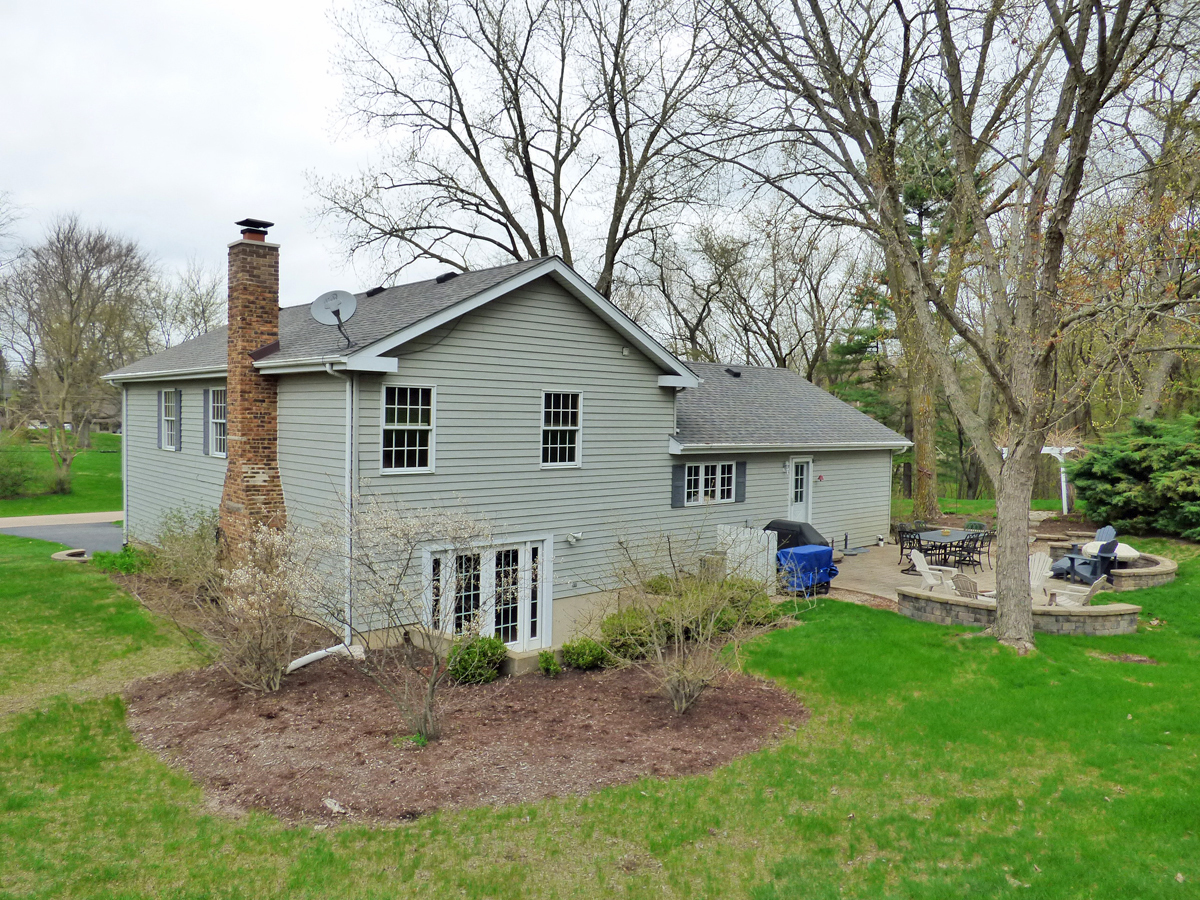 41W121 Whitney Road St. Charles, IL 60175 - Photo 34 of 35 a front view of a house with garden