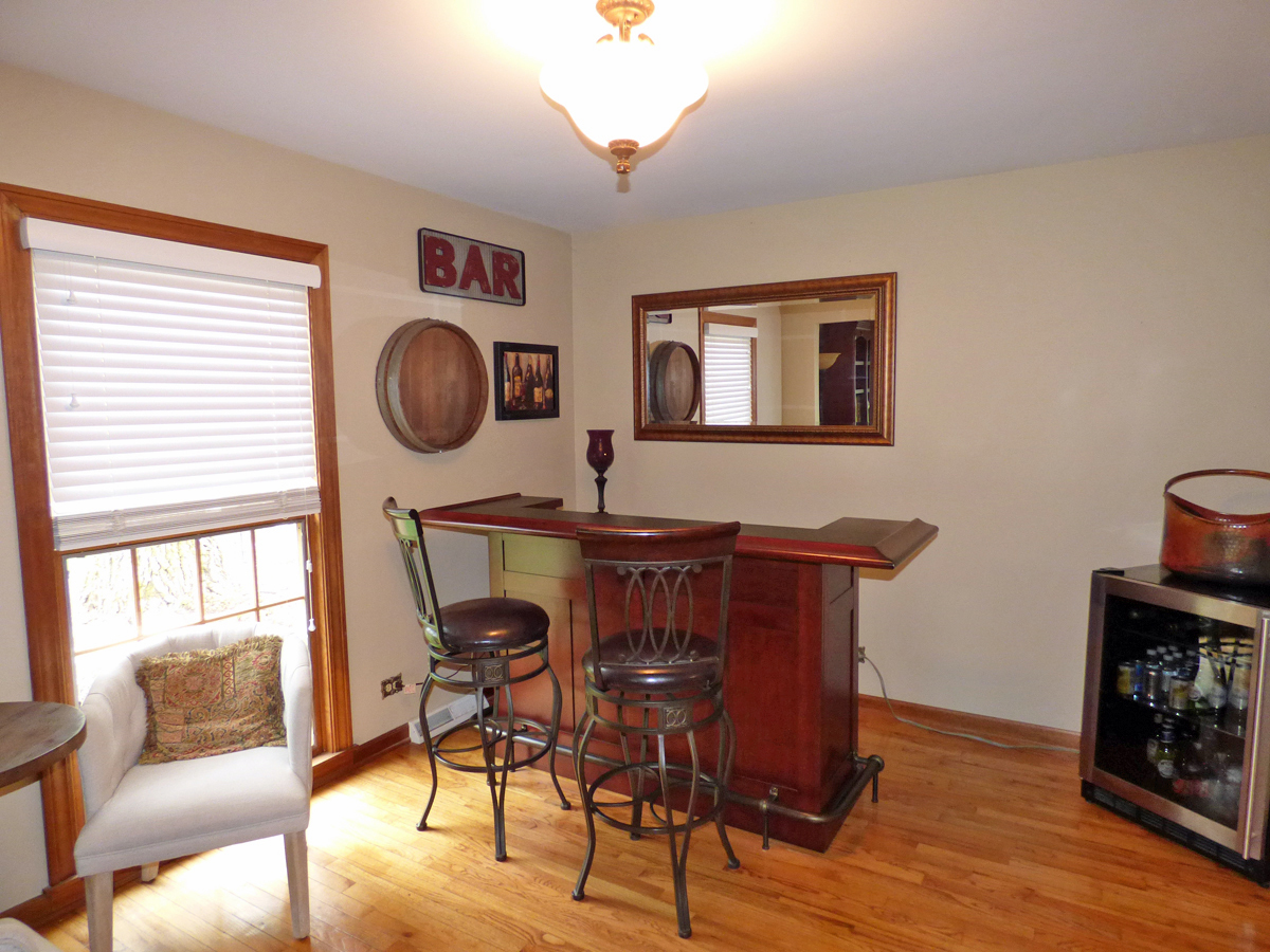 41W121 Whitney Road St. Charles, IL 60175 - Photo 9 of 35 a view of a workspace with furniture and a window
