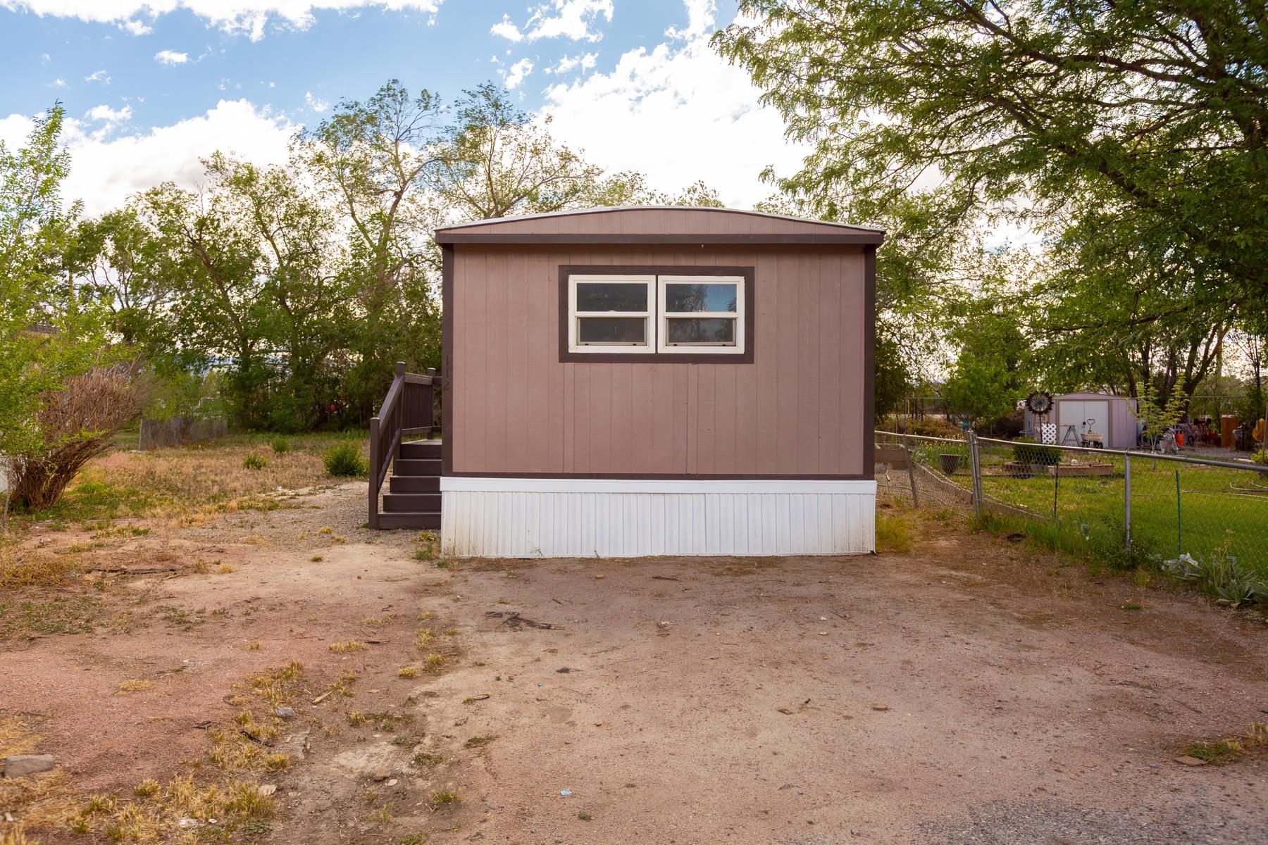 424 32 Road, Unit 112 Clifton, CO 81520 - Photo 2 of 41 a view of a house with a backyard