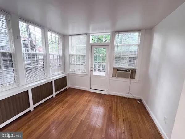 a view of entryway with wooden floor