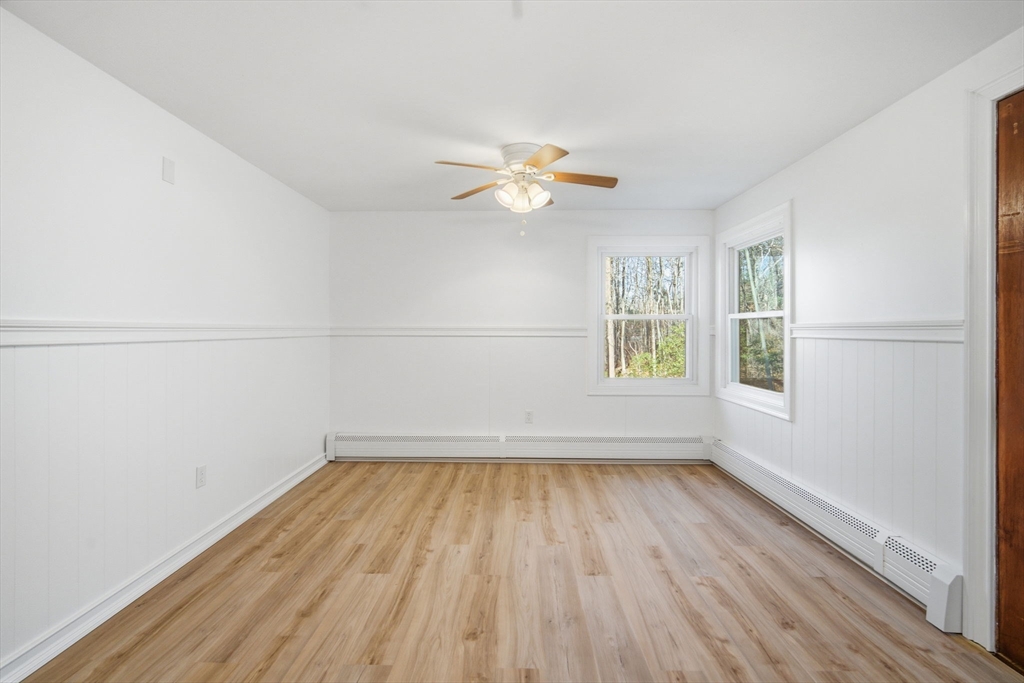 7 Fuller Road Sutton, MA 01590 - Photo 12 of 29 wooden floor in an empty room with a window