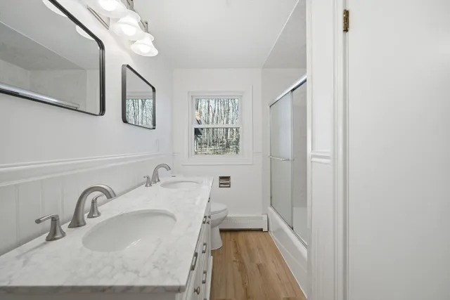 a bathroom with a sink and a large mirror