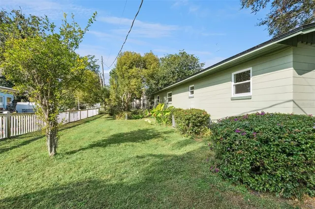 a view of swimming pool with outdoor seating and trees