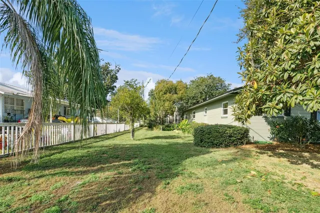 a backyard of a house with lots of green space
