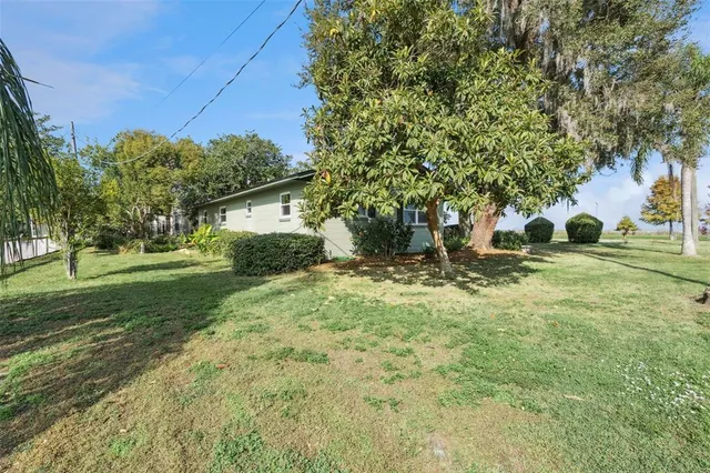 a backyard of a house with lots of green space