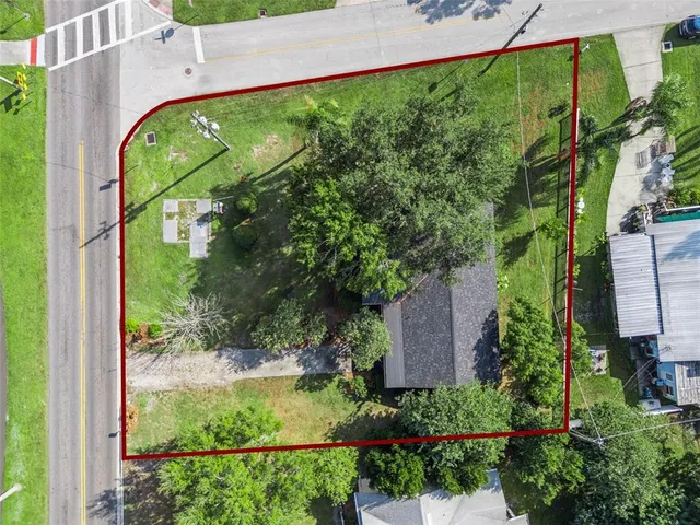 an aerial view of a house with a ocean view