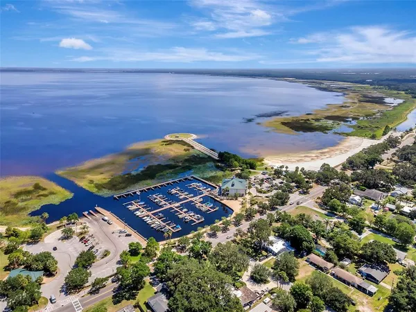 an aerial view of a houses with a lake view