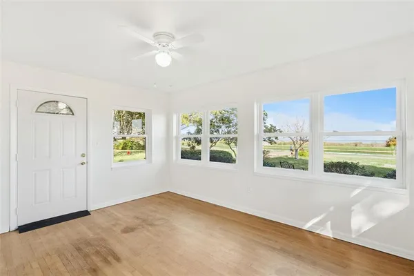 a view of an empty room with a window