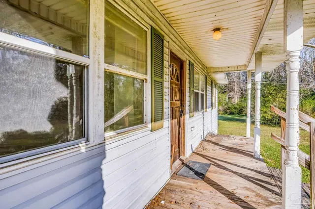 a view of a swimming pool with a porch