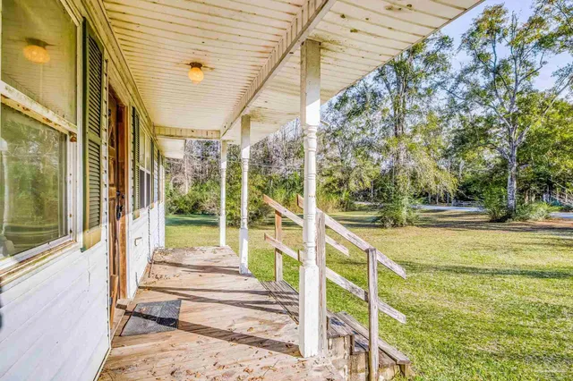 a view of a yard with an outdoor space