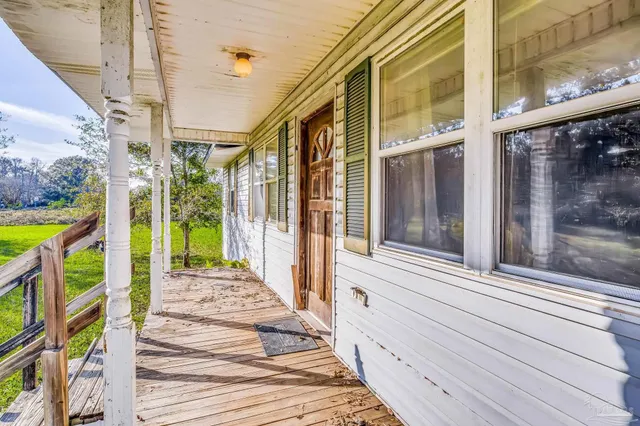 a view of a swimming pool with an outdoor space and seating area