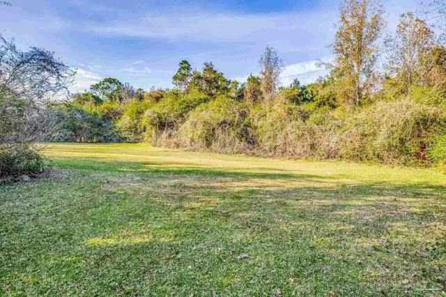 a view of a swimming pool with an outdoor space and seating area