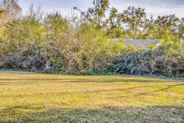 a kitchen with stainless steel appliances a stove top oven and a refrigerator