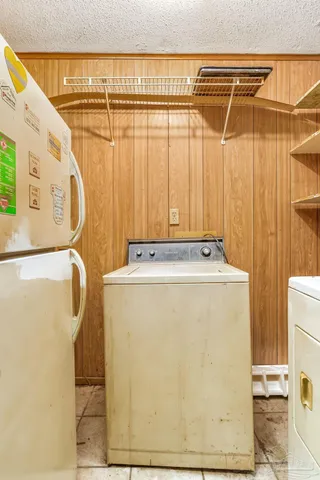 an empty room with a ceiling fan and carpet