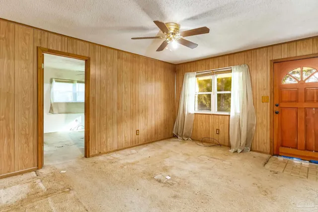 a white bath tub sitting next to a white toilet