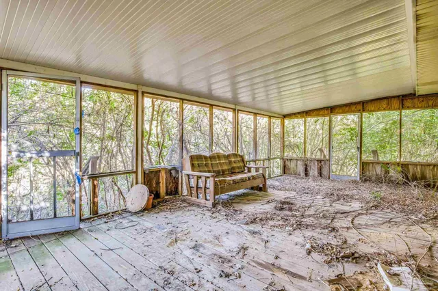 a view of backyard with a large window