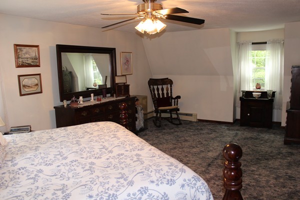 147 S Road Templeton, MA 01468 - Photo 16 of 21 a bedroom with a bed and a flat screen tv