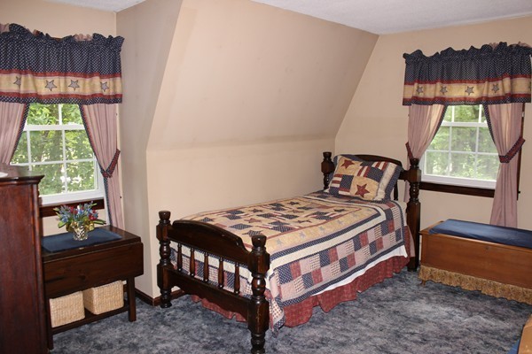 147 S Road Templeton, MA 01468 - Photo 17 of 21 a bedroom with a bed a window and a potted plant