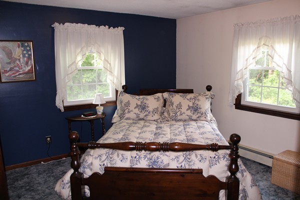 147 S Road Templeton, MA 01468 - Photo 18 of 21 a bed sitting in a bedroom next to a window