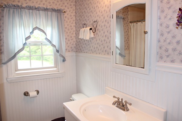 147 S Road Templeton, MA 01468 - Photo 19 of 21 a bathroom with a sink a mirror and a window