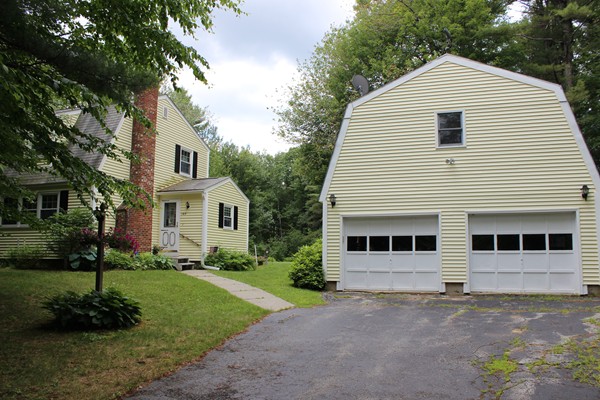 147 S Road Templeton, MA 01468 - Photo 21 of 21 a front view of a house with a yard and garage