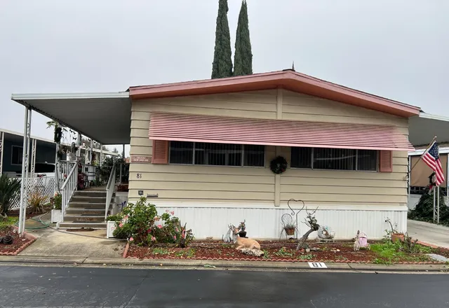 a front view of a house with garage