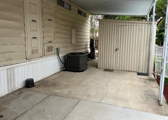 a view of a porch with a door and a window