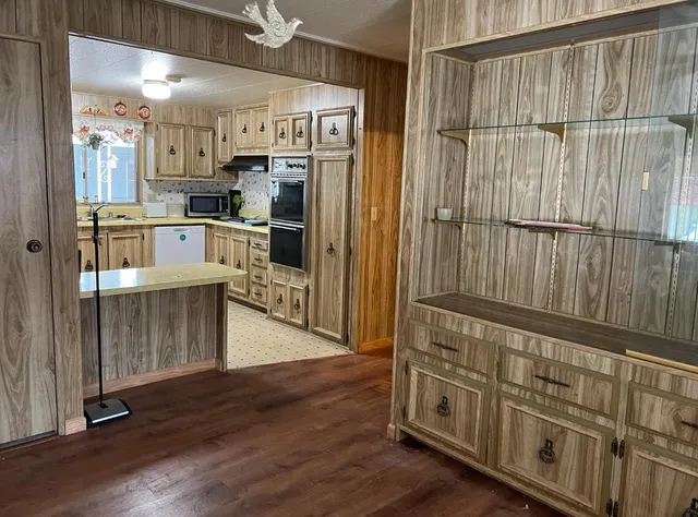 a kitchen with stainless steel appliances a refrigerator and a stove