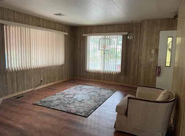 a living room with a couch and a rug