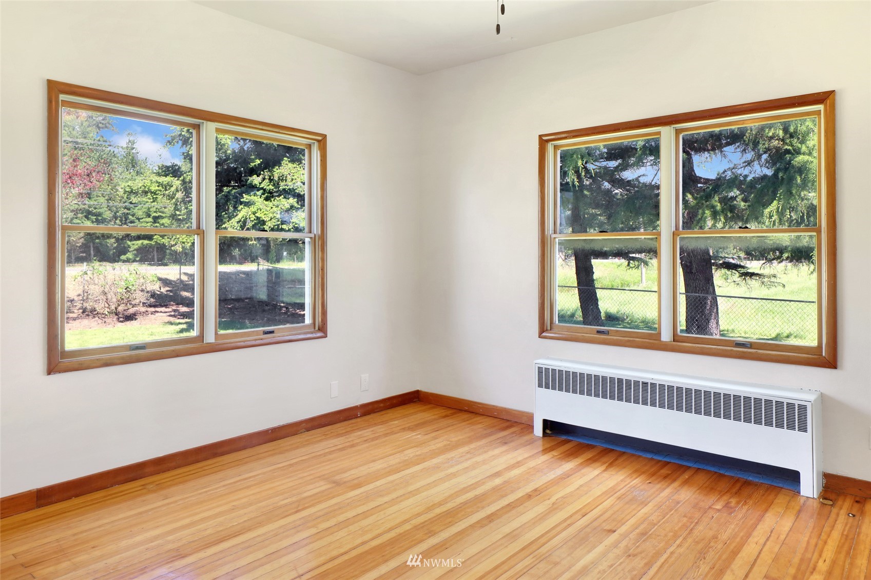 2397 Slater Road Ferndale, WA 98248 - Photo 25 of 40 a view of an empty room with wooden floor and a window
