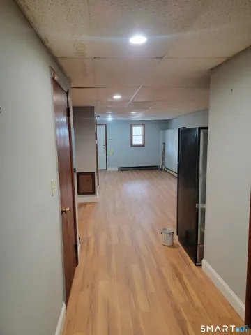 a view of an empty room with a bathroom