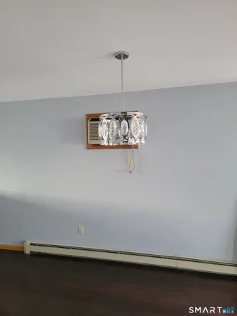 a view of a hallway with a chandelier