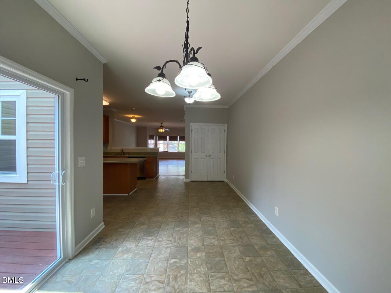 134 Darley Dale Loop Apex, NC 27502 - Photo 11 of 23 a view of a kitchen with a sink and dishwasher cabinet with wooden floor