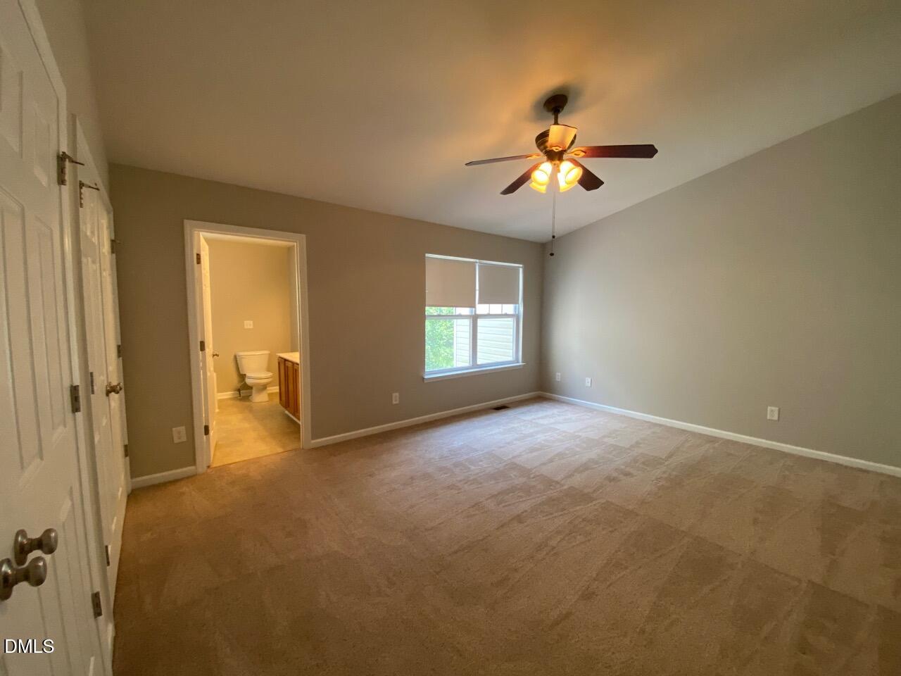 134 Darley Dale Loop Apex, NC 27502 - Photo 17 of 23 a view of empty room with ceiling fan