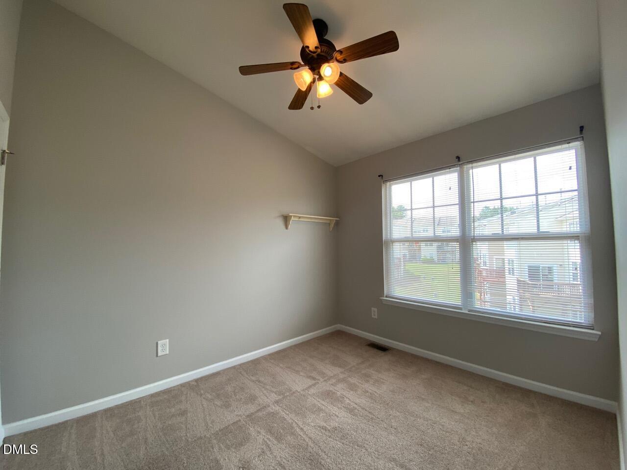 134 Darley Dale Loop Apex, NC 27502 - Photo 19 of 23 a view of an empty room with a window