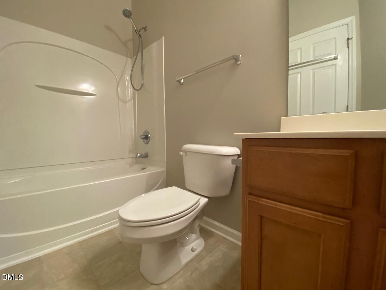 134 Darley Dale Loop Apex, NC 27502 - Photo 21 of 23 a bathroom with a toilet and a shower