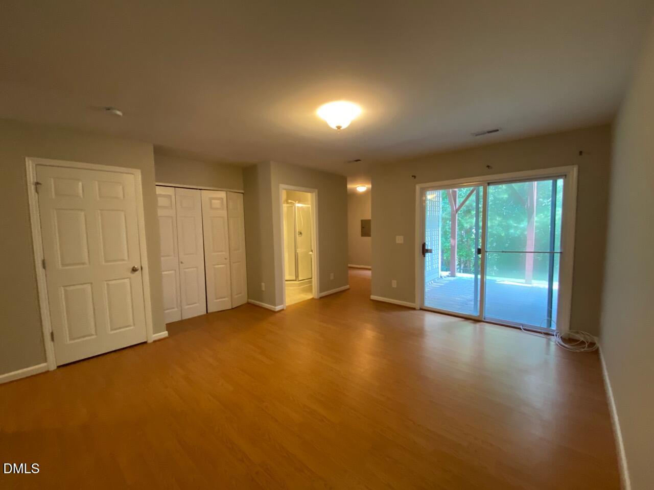 134 Darley Dale Loop Apex, NC 27502 - Photo 4 of 23 a view of an empty room with a window