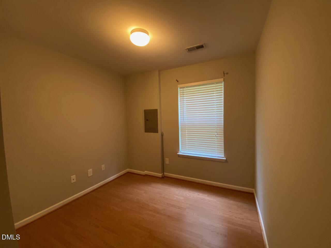 134 Darley Dale Loop Apex, NC 27502 - Photo 7 of 23 a view of an empty room with a window